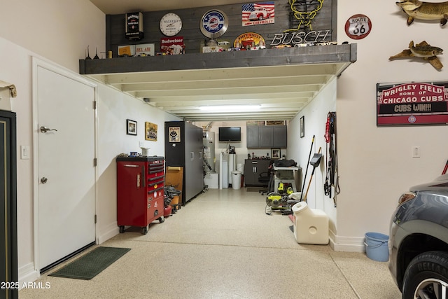 garage featuring baseboards