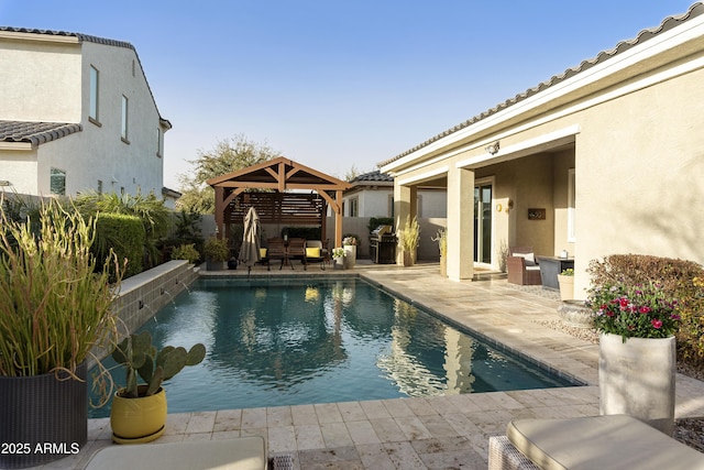 view of pool featuring a gazebo, a fenced in pool, and a patio