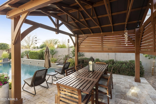 view of patio with a gazebo, a fenced backyard, and a fenced in pool