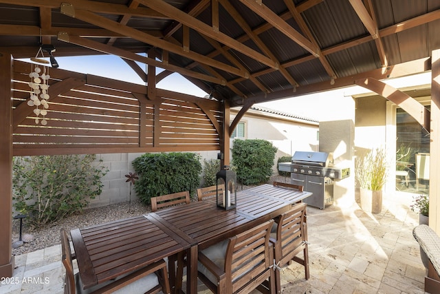 view of patio / terrace with a gazebo, outdoor dining area, and a grill