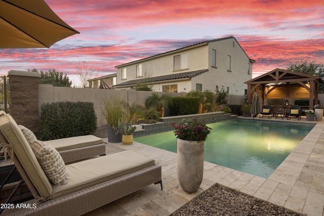 view of swimming pool with a patio area, a fenced backyard, outdoor lounge area, and a gazebo