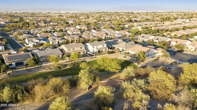 birds eye view of property with a residential view