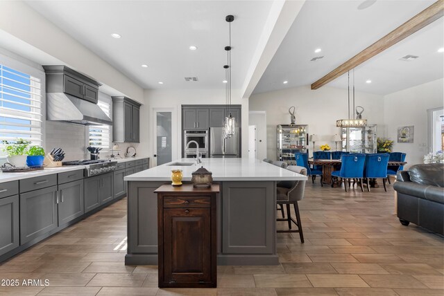 17385 W Sugar Hill Ct, Surprise, AZ 85388 - kitchen featuring gray cabinetry, appliances with stainless steel finishes, light countertops, wood finish floors, and recessed lighting