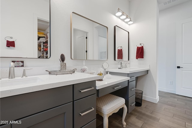 17385 W Sugar Hill Ct, Surprise, AZ 85388 - full bath featuring vanity, wood finished floors, and baseboards