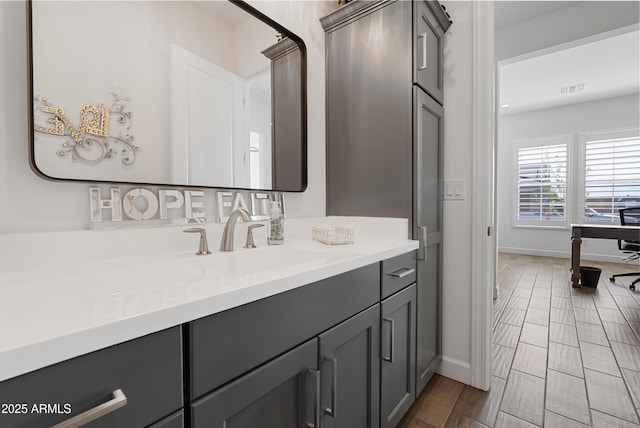 17385 W Sugar Hill Ct, Surprise, AZ 85388 - bathroom with vanity, baseboards, and wood finish floors