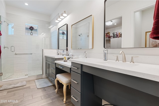 17385 W Sugar Hill Ct, Surprise, AZ 85388 - full bathroom with a stall shower, double vanity, wood finished floors, and recessed lighting