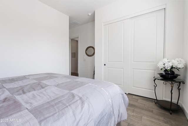 17385 W Sugar Hill Ct, Surprise, AZ 85388 - bedroom featuring wood finished floors and a closet