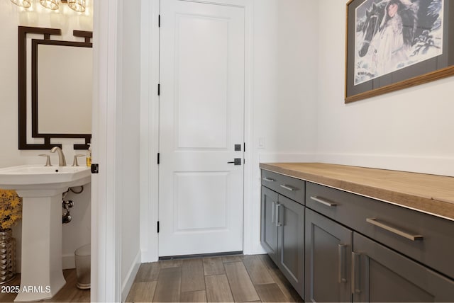 17385 W Sugar Hill Ct, Surprise, AZ 85388 - bathroom featuring wood finished floors and a sink