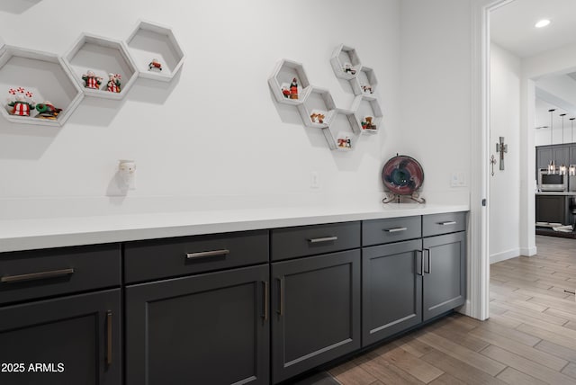 17385 W Sugar Hill Ct, Surprise, AZ 85388 - detailed view of wood finished floors, recessed lighting, and baseboards