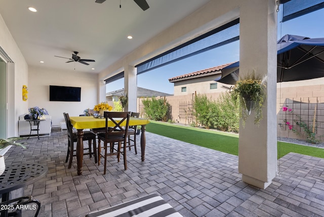 17385 W Sugar Hill Ct, Surprise, AZ 85388 - fenced backyard featuring a ceiling fan, outdoor dining space, and a patio area