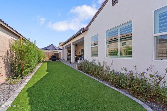 17385 W Sugar Hill Ct, Surprise, AZ 85388 - view of yard featuring a patio and ceiling fan