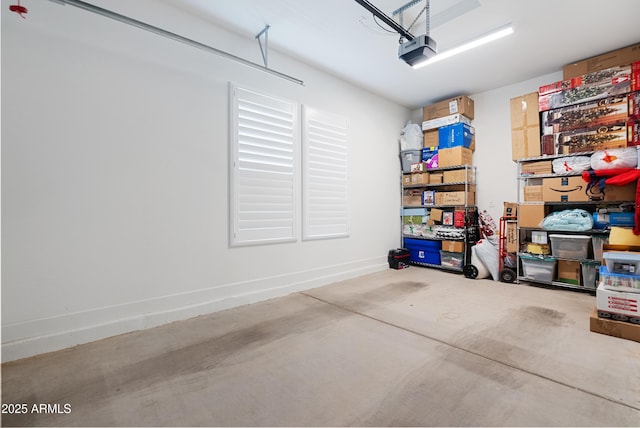 17385 W Sugar Hill Ct, Surprise, AZ 85388 - garage with a garage door opener and baseboards