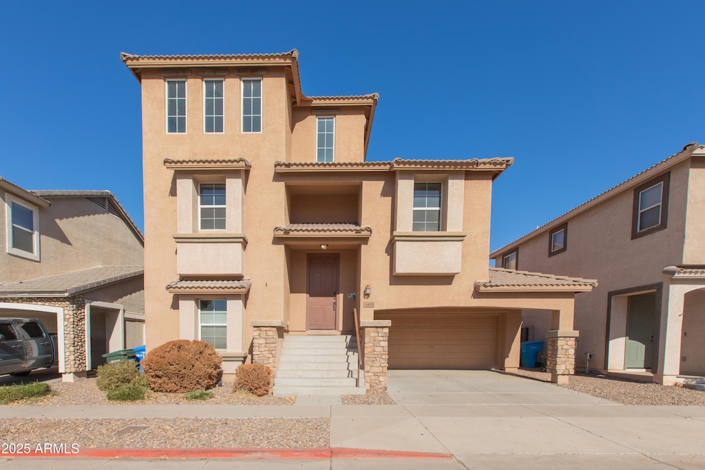 mediterranean / spanish-style home featuring a garage