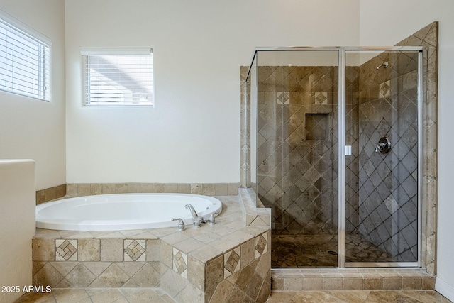 full bathroom with a garden tub and a stall shower