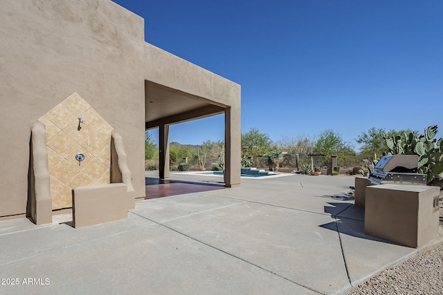 view of patio / terrace with an outdoor pool