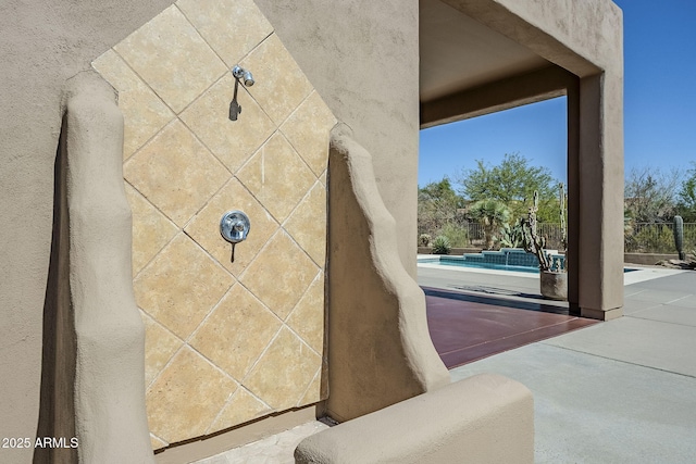 exterior details with a pool