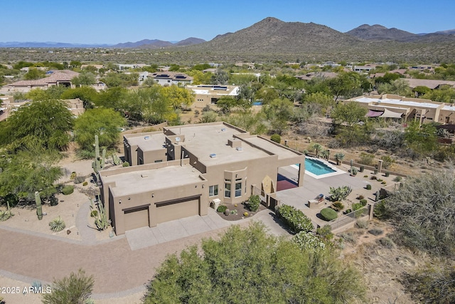 birds eye view of property with a mountain view