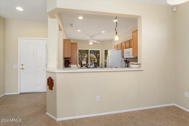 kitchen with ceiling fan, light tile patterned flooring, kitchen peninsula, white appliances, and decorative light fixtures