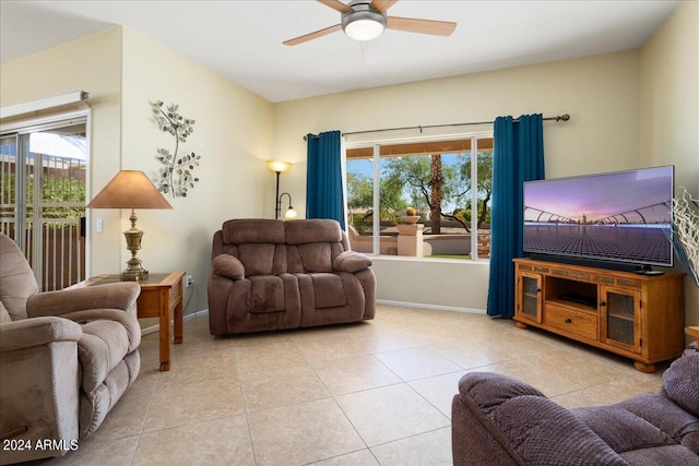 tiled living room featuring ceiling fan and a healthy amount of sunlight