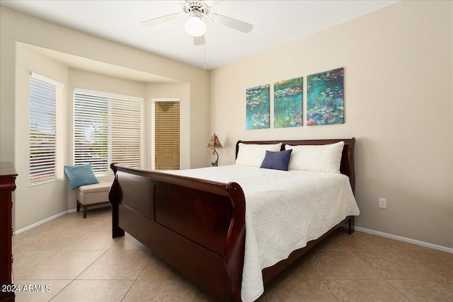 bedroom featuring ceiling fan and light tile patterned floors