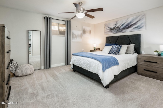 bedroom with ceiling fan and light carpet