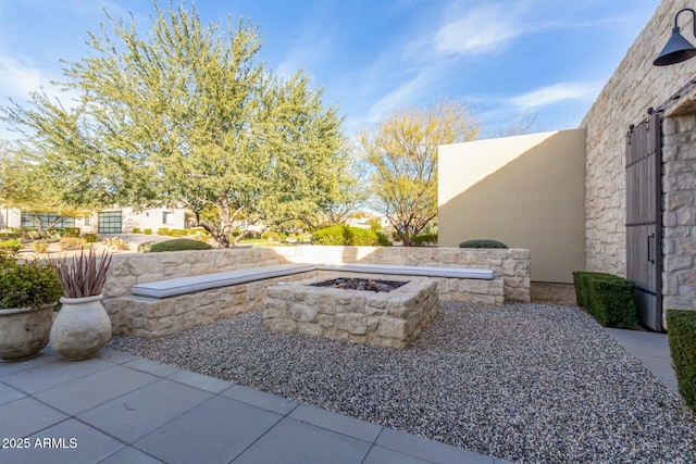 view of patio featuring a fire pit