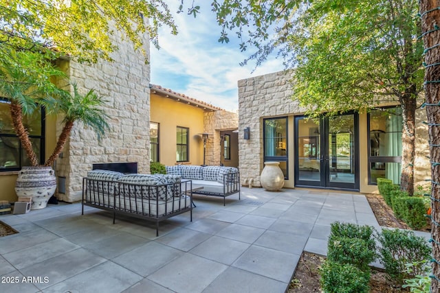 view of patio featuring outdoor lounge area and french doors