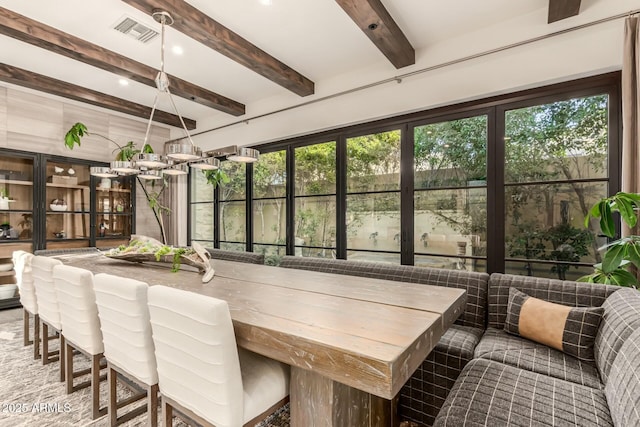 sunroom / solarium with beamed ceiling