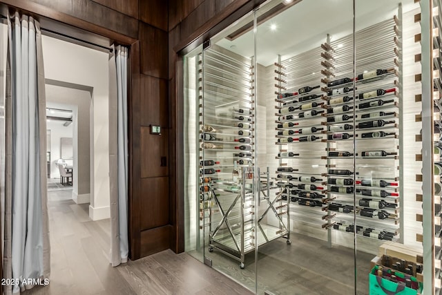 wine room with hardwood / wood-style flooring