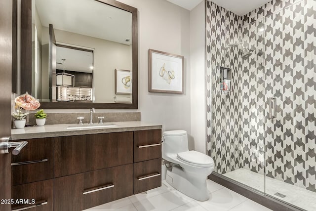 bathroom with tile patterned floors, vanity, toilet, and a shower