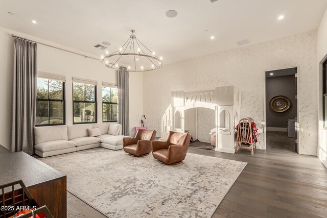 living room featuring dark hardwood / wood-style floors and a chandelier