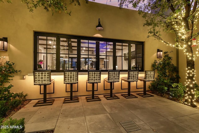 view of patio terrace at dusk