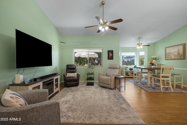 5830 E Mckellips Rd Unit 2, Mesa, AZ 85215 - living room featuring wood finished floors, a ceiling fan, and baseboards