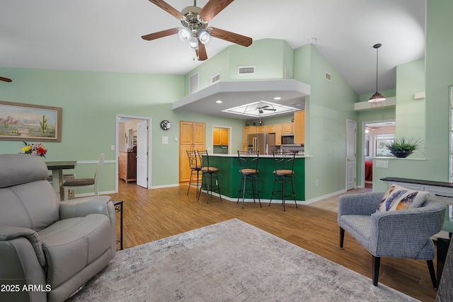 5830 E Mckellips Rd Unit 2, Mesa, AZ 85215 - living area with a ceiling fan, light wood-style floors, high vaulted ceiling, and baseboards