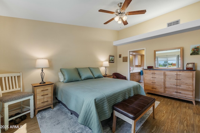 5830 E Mckellips Rd Unit 2, Mesa, AZ 85215 - bedroom with wood finished floors, connected bathroom, and ceiling fan