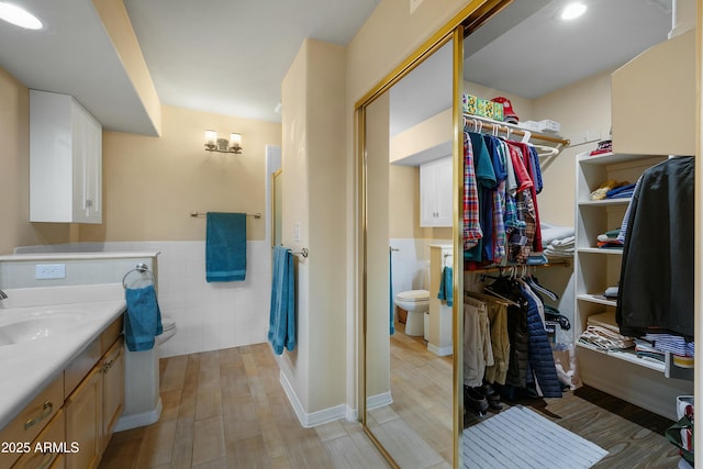 5830 E Mckellips Rd Unit 2, Mesa, AZ 85215 - full bath with toilet, tile walls, a spacious closet, vanity, and wainscoting