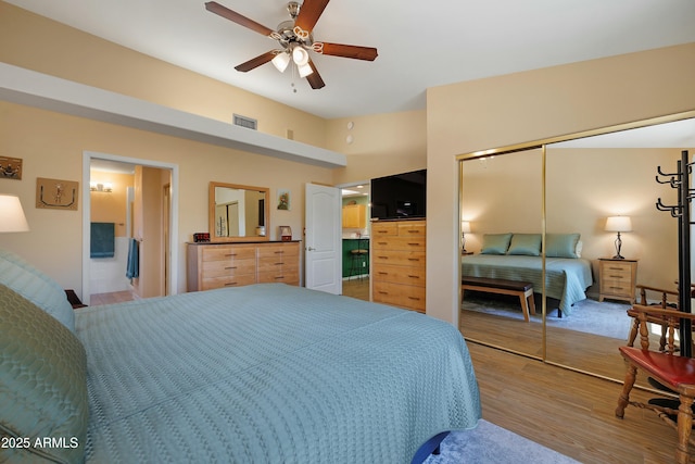 5830 E Mckellips Rd Unit 2, Mesa, AZ 85215 - bedroom featuring light wood finished floors, a closet, and ceiling fan
