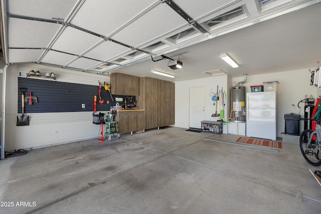5830 E Mckellips Rd Unit 2, Mesa, AZ 85215 - garage featuring freestanding refrigerator, water heater, and a garage door opener