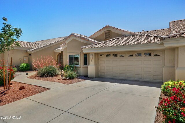 5830 E Mckellips Rd Unit 2, Mesa, AZ 85215 - view of front of home with a garage, concrete driveway, stucco siding, and a tile roof