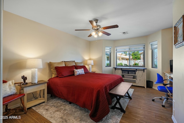 5830 E Mckellips Rd Unit 2, Mesa, AZ 85215 - bedroom featuring wood finished floors, baseboards, and ceiling fan