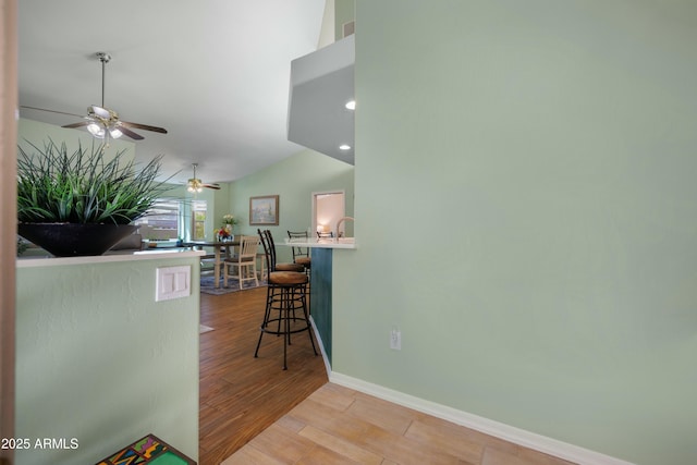 5830 E Mckellips Rd Unit 2, Mesa, AZ 85215 - corridor with wood finished floors, baseboards, vaulted ceiling, and recessed lighting