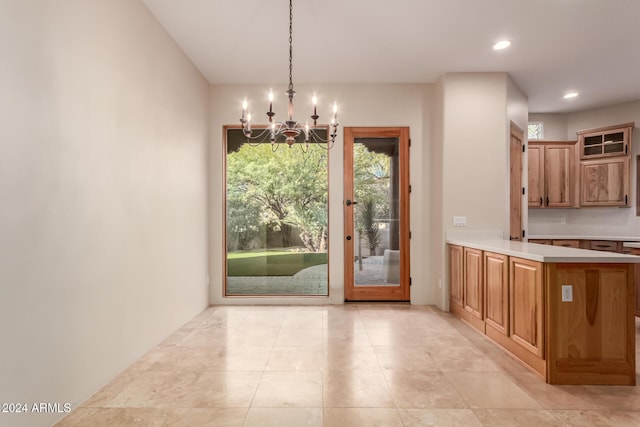 unfurnished dining area featuring a notable chandelier