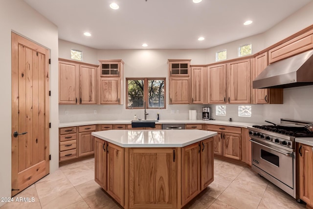 kitchen featuring extractor fan, sink, light tile patterned floors, stainless steel stove, and a kitchen island