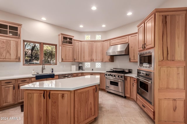 kitchen with sink, a center island, stainless steel appliances, ventilation hood, and light tile patterned floors