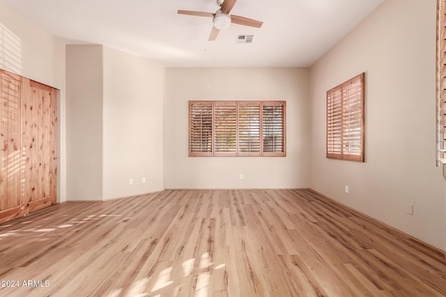 unfurnished room featuring ceiling fan and light hardwood / wood-style floors