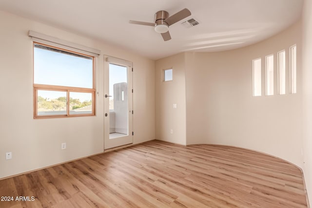 spare room featuring ceiling fan and light hardwood / wood-style floors