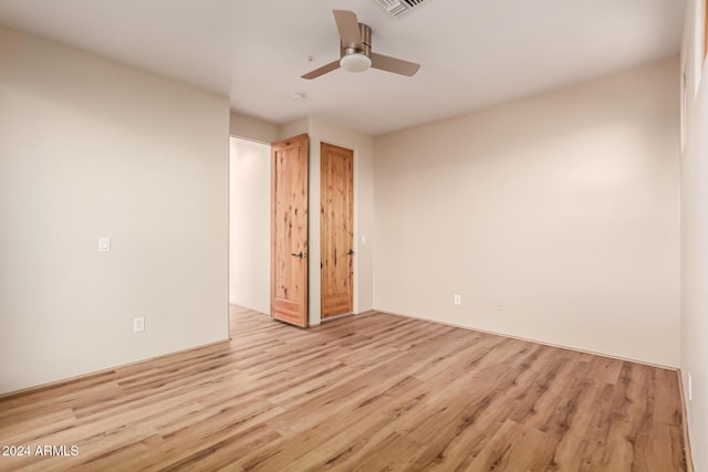 unfurnished bedroom featuring ceiling fan and light hardwood / wood-style floors