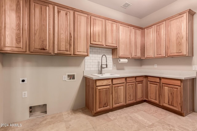 kitchen featuring decorative backsplash and sink