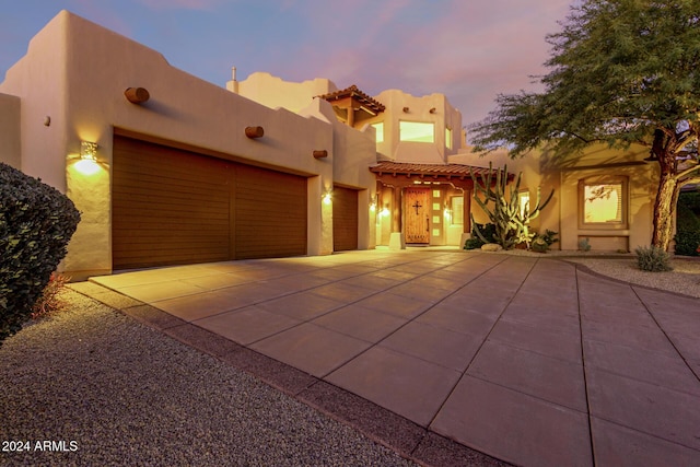 adobe home featuring a garage