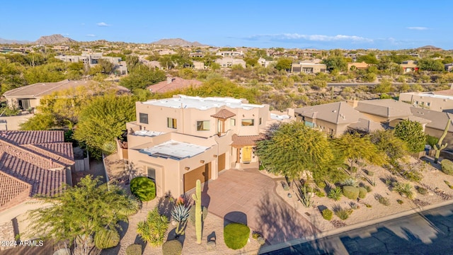 birds eye view of property with a mountain view